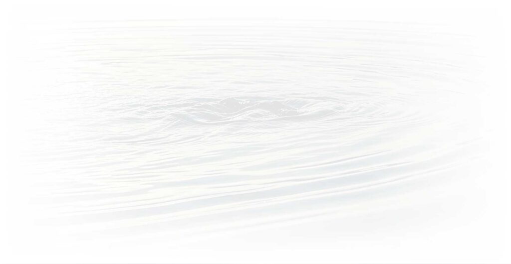 Faded white image of circular water ripples expanding on a calm lake surface